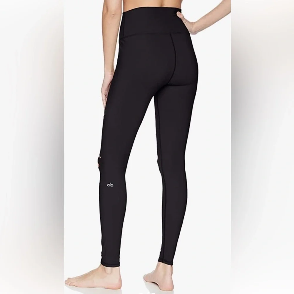 ALO Yoga black ripped high waist warrior leggings.